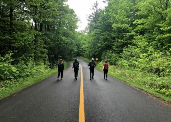 4 students walking on the car-free Gatineau Parkway