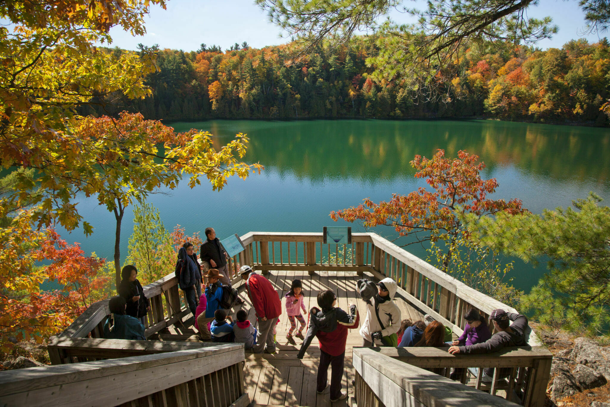 People on a lookout on Pink Lake in the fall.