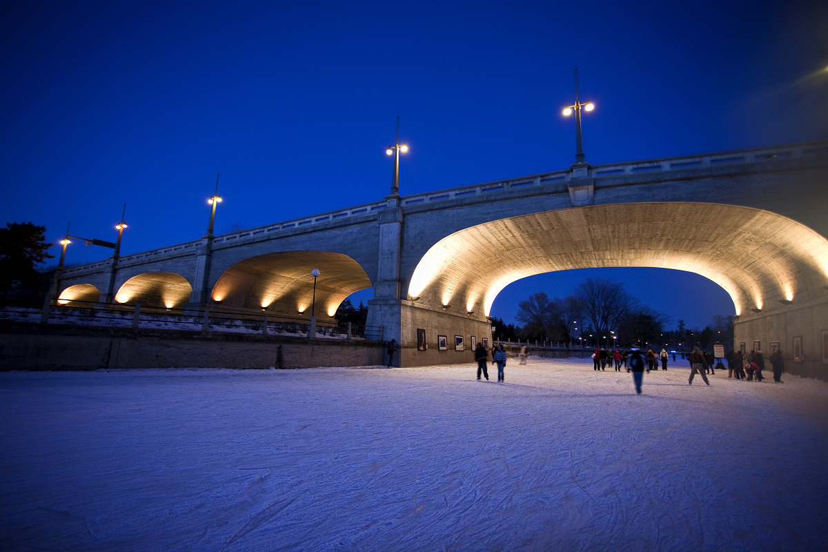 Lit Bank Street Bridge at night.