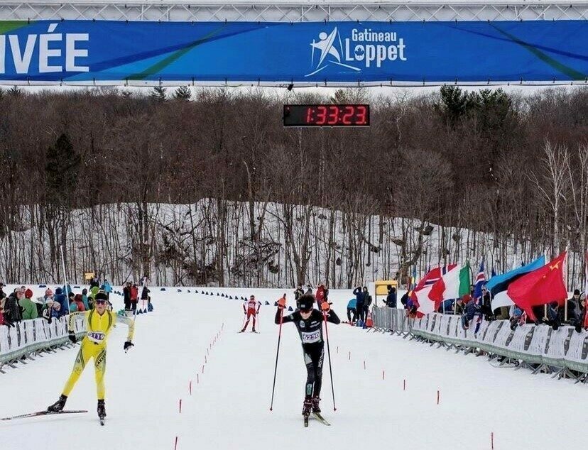 Cross-country skiers arriving at the finish line of the Gatineau Loppet.